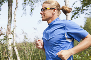 Image showing Trail runner in summer