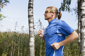 Image showing Trail runner in summer