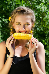 Image showing woman eating corn-cob