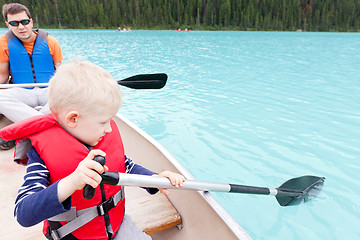 Image showing father and son on a lake