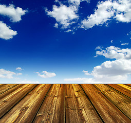 Image showing blue sky and wood floor background