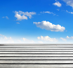 Image showing blue sky and wood floor background