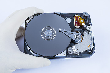 Image showing technician with open hard-disk