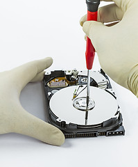 Image showing technician with open hard-disk