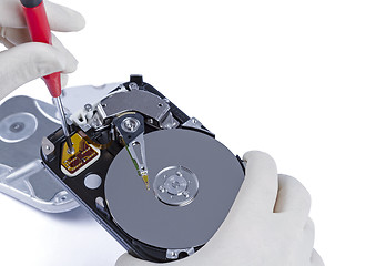 Image showing technician with open hard-disk