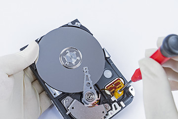 Image showing technician with open hard-disk