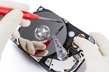 Image showing technician with open hard-disk