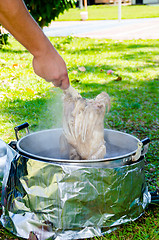 Image showing chicken soaked in hot water