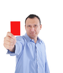 Image showing Young businessman is showing a red card 