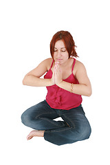 Image showing Calm woman doing relaxing yoga exercises 