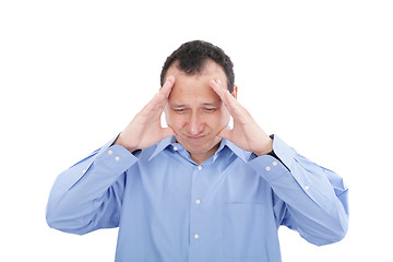 Image showing Stressed business man with a headache, isolated over white