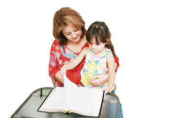 Image showing Minority woman and her daughter reading the Bible 