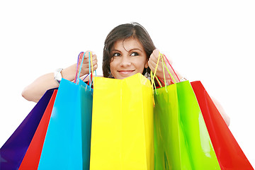 Image showing Beautiful shopping woman holding bags isolated over white backgr