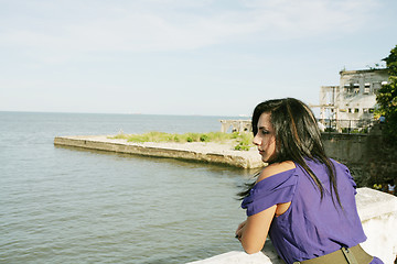 Image showing Beautiful caucasian woman looking out over sea 