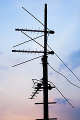 Image showing silhouette of television antennas on the roof...