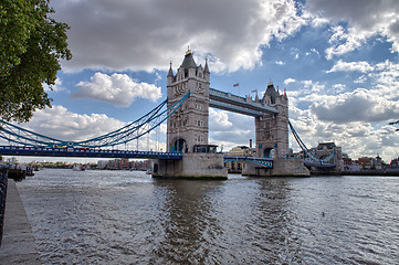 Image showing Side view of Tower Bridge with river Thames, London