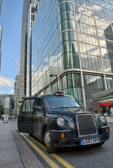 Image showing LONDON - SEP 27: A taxi awaits for customer to come inside in Ca