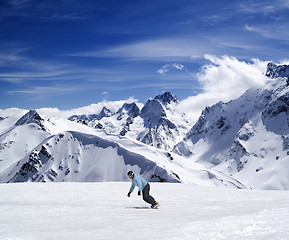 Image showing Young snowboarder on ski slope