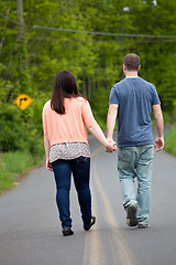 Image showing Couple Walking Down the Road Together