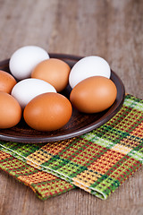 Image showing eggs in a plate and towel 
