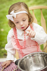 Image showing Adorable Little Girl Playing Chef Cooking