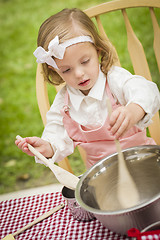 Image showing Adorable Little Girl Playing Chef Cooking