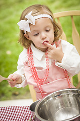 Image showing Adorable Little Girl Playing Chef Cooking