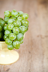 Image showing fresh green grapes in a yellow bowl 