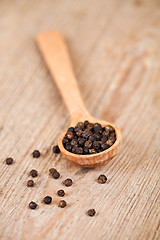 Image showing black pepper in wooden spoon