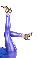 Image showing Sexy stylish legs in shimmering blue leggins