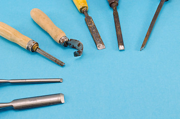 Image showing chisel graver carve tools collection on blue 