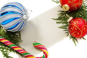 Image showing Christmas balls, candy and cards.