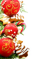 Image showing Candy, Christmas balls and ginger biscuits. 