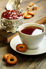 Image showing Tea with small bagels and fig jam.