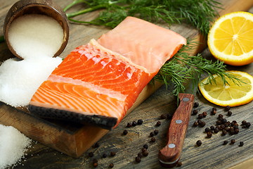 Image showing Fresh salmon with dill and lemon slice. 