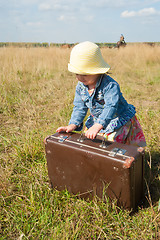 Image showing lonely girl with suitcase