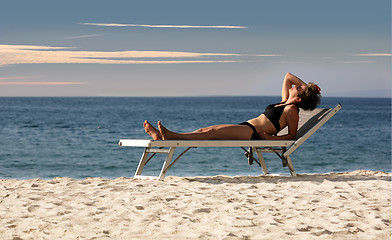 Image showing Woman relaxing on a beach