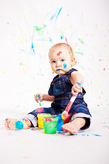 Image showing cute little baby painting and splatter with colours