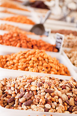Image showing variation of nuts on market outdoor in summer