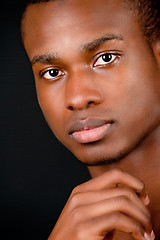 Image showing young african man with dark skin looking