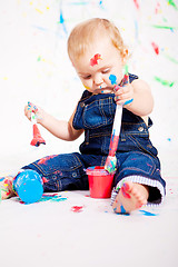 Image showing cute little baby painting and splatter with colours