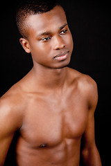 Image showing young african man with dark skin looking