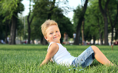 Image showing Little boy sitting in the park