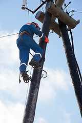 Image showing Electrician working at height