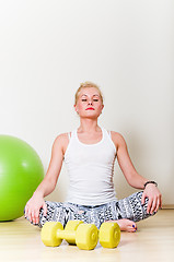 Image showing a young woman engages in aerobics 