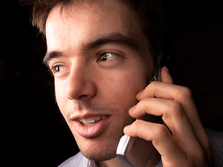 Image showing Young man talking on cell phone