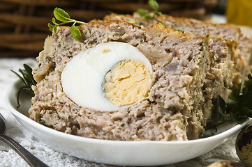 Image showing Baked meatloaf with boiled eggs for Easter 