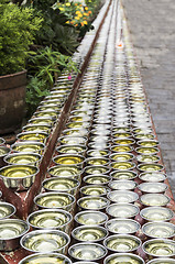 Image showing small bowls with water around a temple