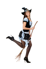 Image showing Playful young woman with a besom