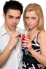 Image showing Attractive young couple with cocktails. Isolated